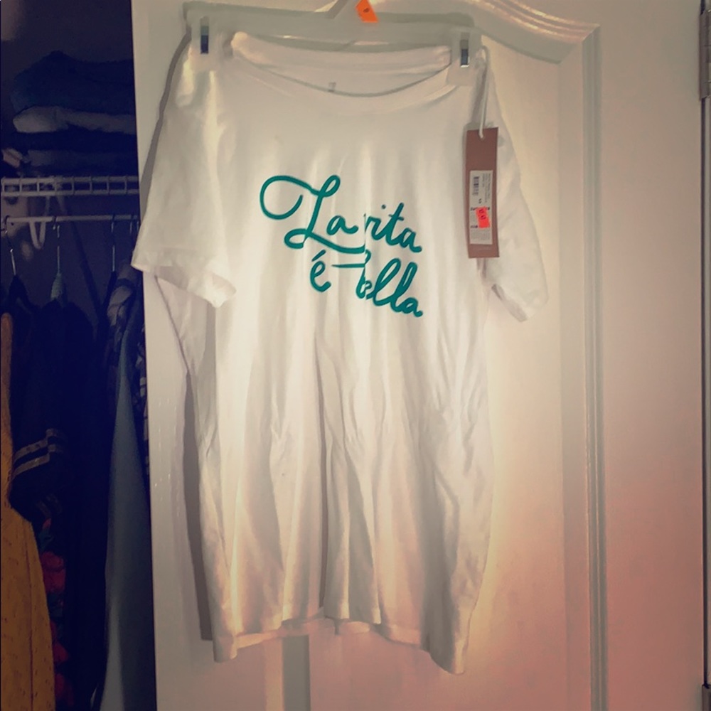 White shirt with green writing.